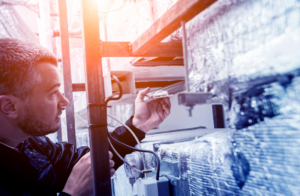 man repairing HVAC