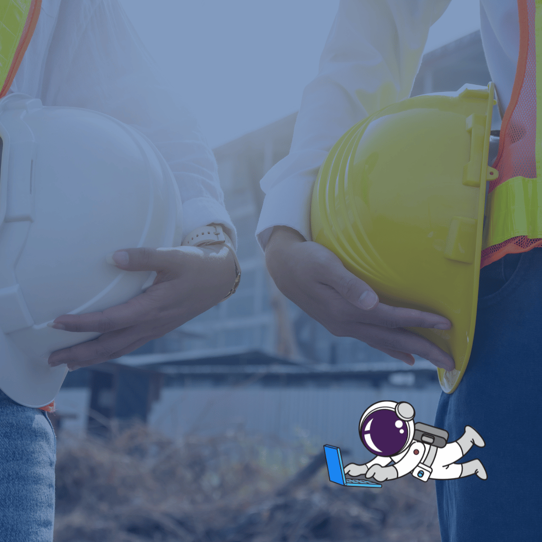 Two people in hard hats, discussing a contractos project.