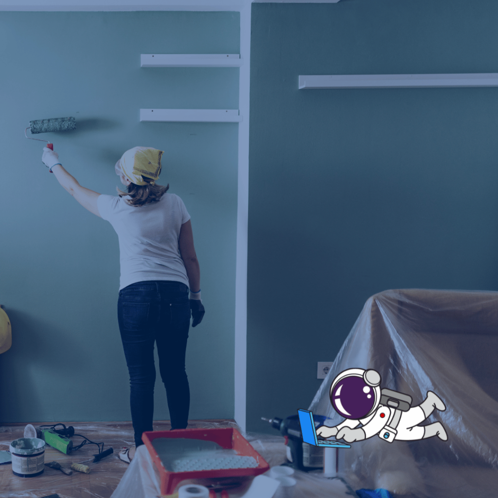 Female home improver painting a room with a paintbrush.