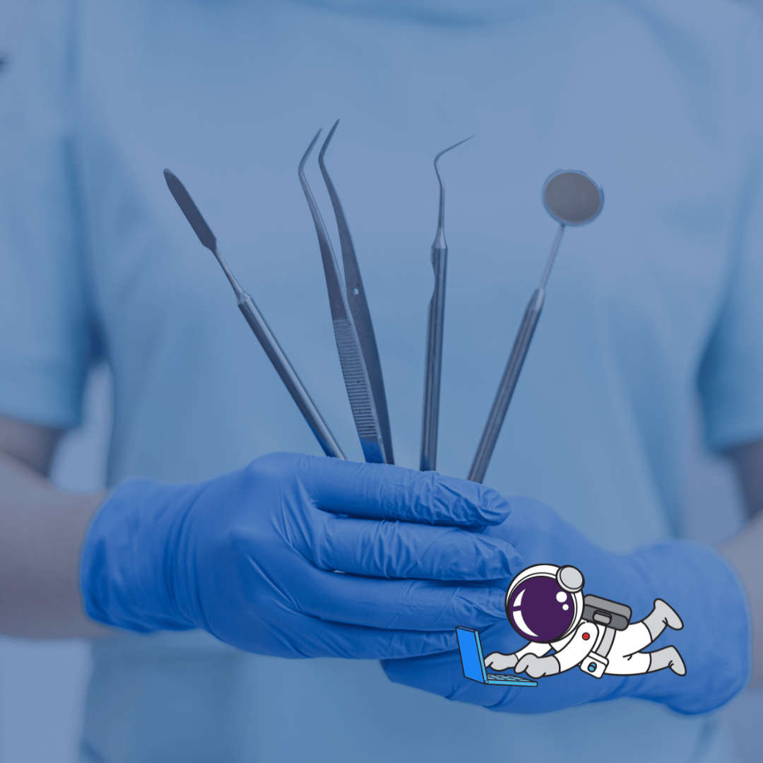 A dentist holding a set of dental tools, ready to perform a procedure.